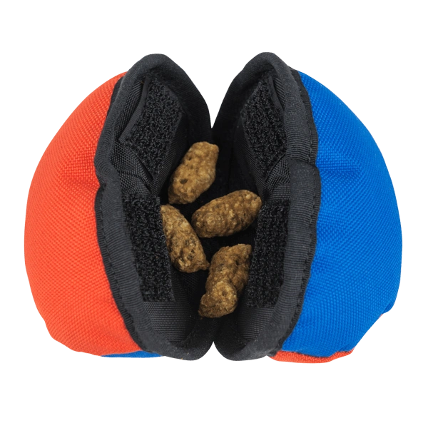 Clam open showing kibble in the middle for the dog to open.  Clam is Blue & Orange.