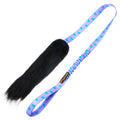 Lilac‑handled Sheepskin Bungee Chaser dog toy with a naturally scented sheepskin bite zone and long bungee handle for distraction‑melting chase and tug play